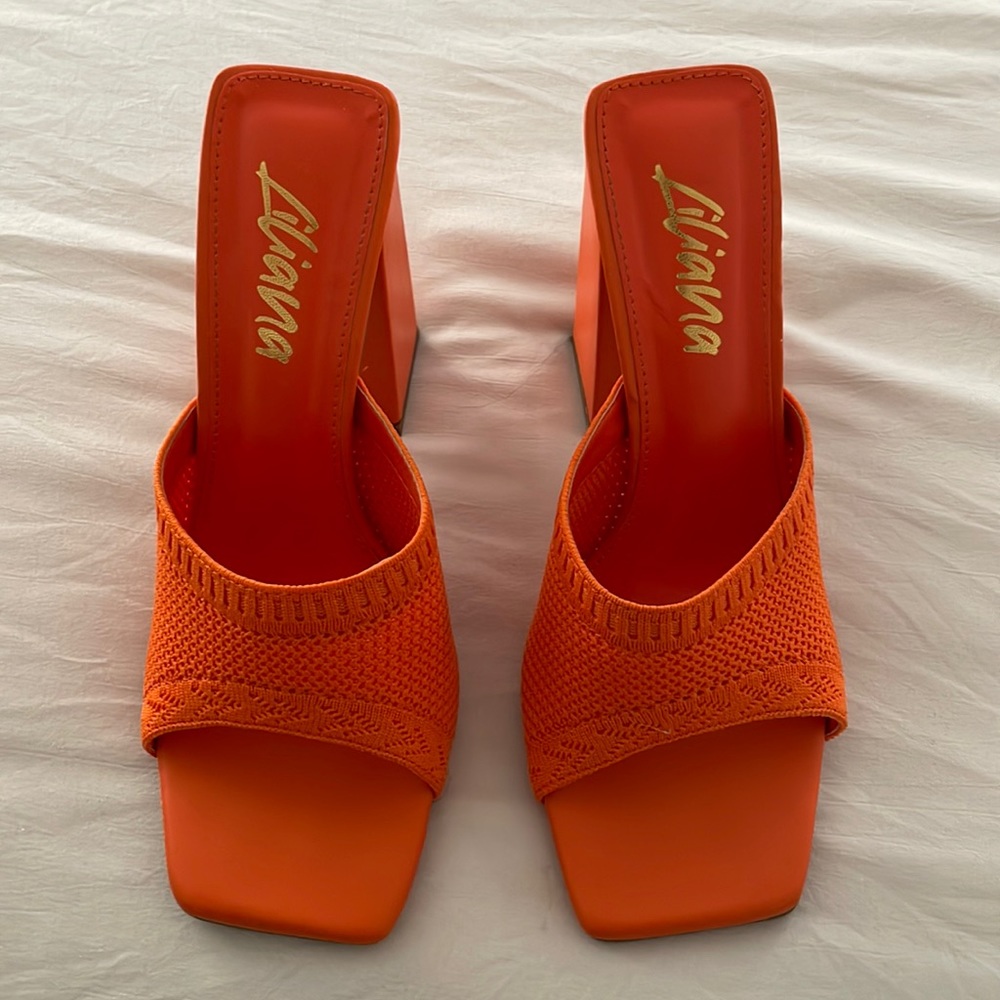 Orange block heels with stretch strap.